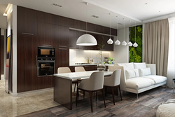 Interior of a living room combined with a kitchen in a modern style photo