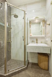 Bathroom interior with glass shower partition and toilet photo