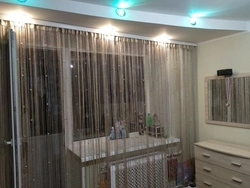 Thread curtains for the kitchen in the interior real photos