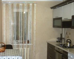 Thread curtains for the kitchen in the interior real photos
