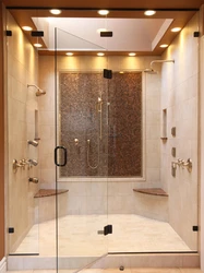 Shower in a bathroom without a cubicle made of tiles photo