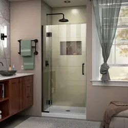 Shower in a bathroom without a cubicle made of tiles photo