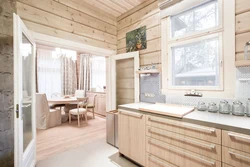 Kitchen design in a modern style in a wooden house