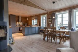 Kitchen design in a modern style in a wooden house