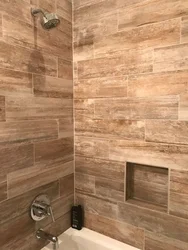 Wood-look porcelain tiles on the wall in the bathroom photo