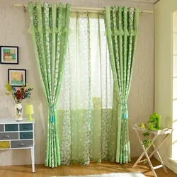 Light green curtains in the kitchen interior