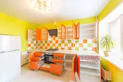 Orange kitchen in the interior photo with what kind of wallpaper and curtains
