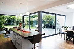 Kitchen with panoramic window in apartment photo design