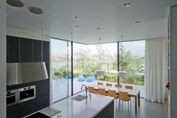 Kitchen with panoramic window in apartment photo design