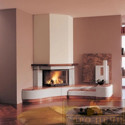 Corner fireplace in the interior of the living room in the house