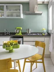 Green walls in the kitchen interior photo