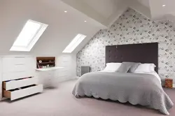 Photo of bedroom design with sloping ceiling