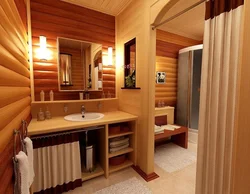 Design of a bath with toilet and shower in a wooden house