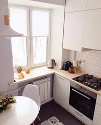 Kitchen design in Khrushchev with refrigerator and machine