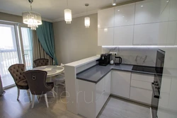 Kitchen design with bar counter, table and sofa
