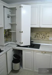 Photo of a kitchen in a house with a boiler on the wall