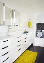 White furniture in the bathroom interior