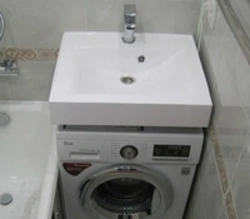 Bath design with washing machine under the sink