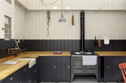 Wall made of MDF panels in the kitchen photo design