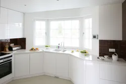 Corner kitchen design with sink by the window