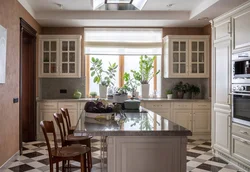 Kitchen design with a window and access to the terrace photo