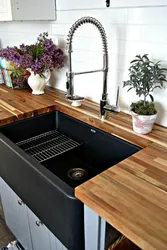 Black sink in the kitchen interior
