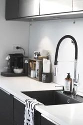 Black sink in the kitchen interior