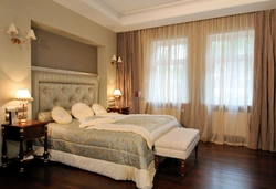 Bedroom interior with two large windows