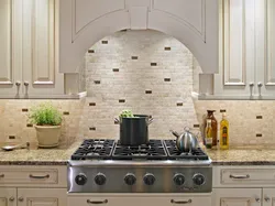 Laying Tiles On A Kitchen Backsplash Photo