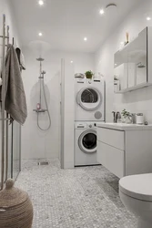 Small bathroom with shower and washing machine photo