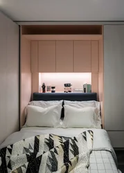 Bedroom in the niche of the room photo