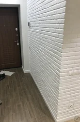 Plaster bricks on the wall in the hallway interior