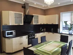 Beige kitchen design with black countertop
