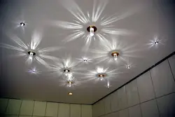 Photo of a ceiling with spotlights and a chandelier in the bedroom