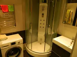 Interior of small bathrooms with shower and washing machine