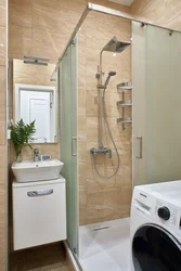 Small bath design with shower and washing machine photo