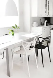 White chairs and table in the kitchen interior