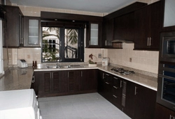 Photo of corner kitchens in a house with a window