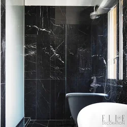 Dark marble in the bathroom interior