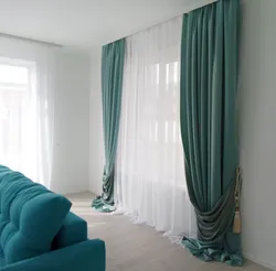 Turquoise color of curtains in the living room interior photo