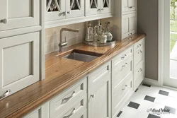 Kitchen with wooden countertop in beige interior