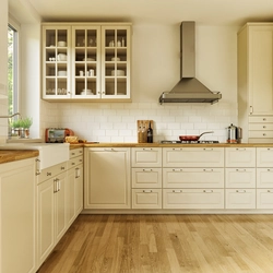 Kitchen with wooden countertop in beige interior