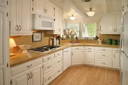 Kitchen with wooden countertop in beige interior