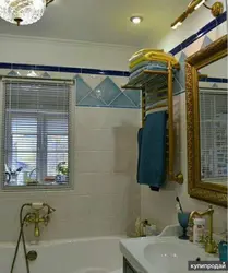 Khrushchev kitchen design with a window to the bathroom