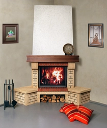 Corner fireplace in the apartment interior