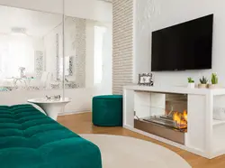 Bio-fireplace in the interior of the living room with TV