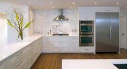 Photo of a kitchen without upper cabinets with an apron