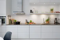 Photo of a kitchen without upper cabinets with an apron