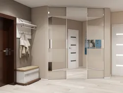 Built-in wardrobe in the hallway in light colors photo