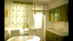 Window design with a balcony door in the kitchen in a modern style